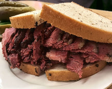 Load image into Gallery viewer, A Katz deli style sandwich made with Pastrami